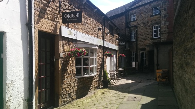 The brick facade of cafe Oldbell on the cobbled streets of Lancaster