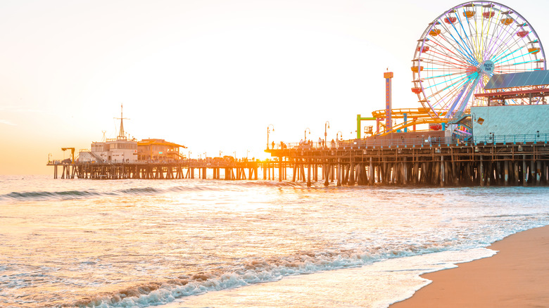 Santa Monica beach and boardwalk at sunset.