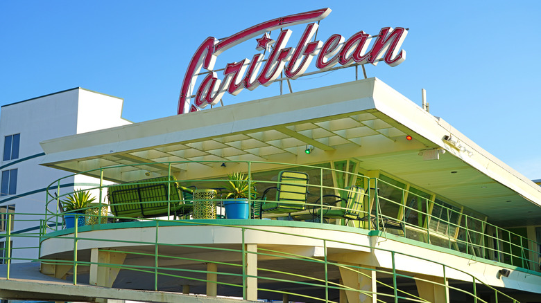 Exterior of the Caribbean Motel and sign