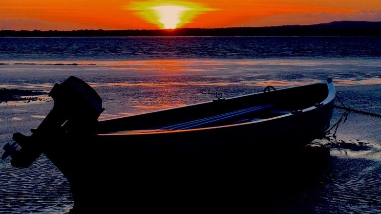 A boat on the water in Rosslare, Ireland at sunset