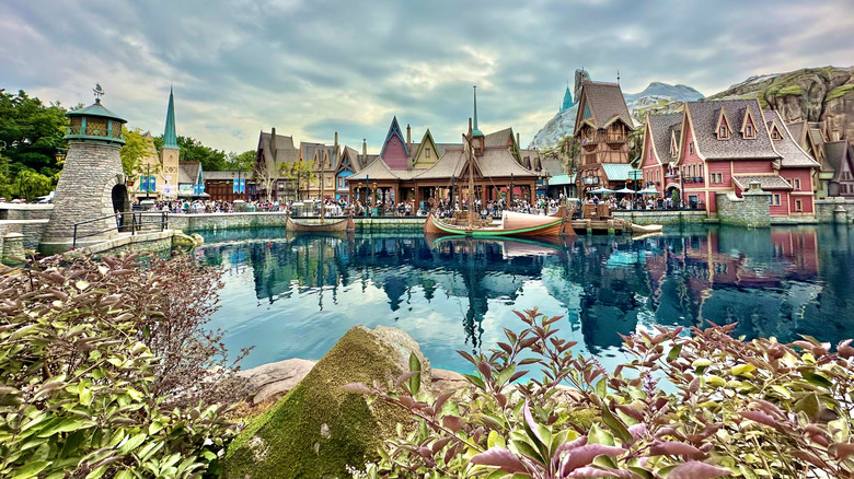 Exterior image of the lake, boats, and houses at the World of Frozen, one of the themed lands in Hong Kong Disneyland resort in Hong Kong, photographed on a cloudy day