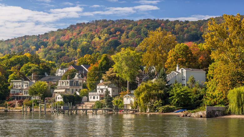 Homes on a bank of the Hudson River in New York during fall