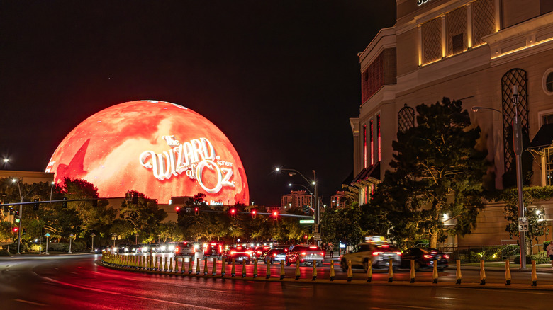 The Sphere in Las Vegas lit up on red and orange highlight "The Wizard of Oz" show