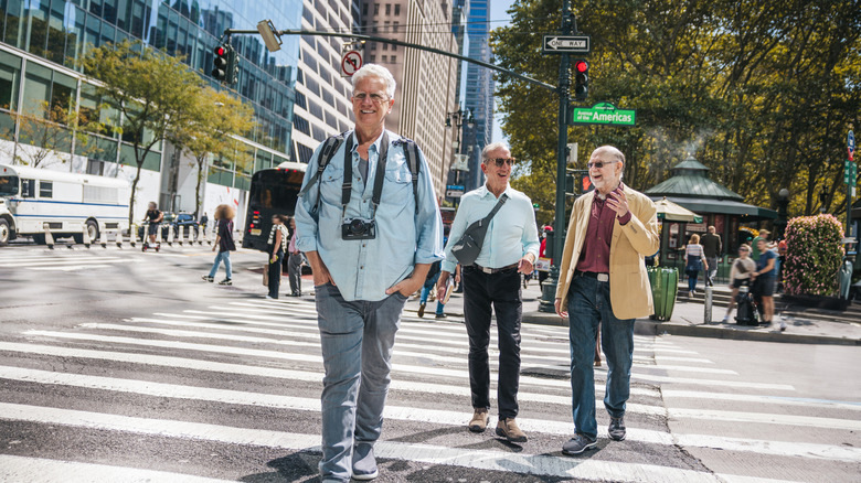 Three older friends walking around Manhattan in New York