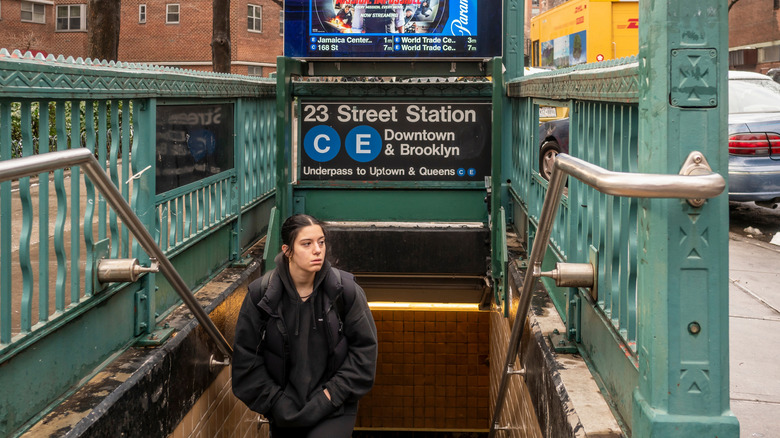 Someone walking out of the 23 Street Station in New York City