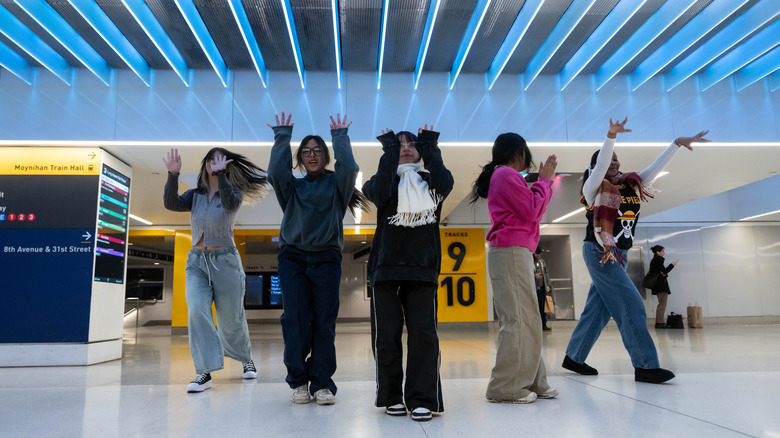 Five members of Eternal Dance Crew practice and record their performance for social media inside Moynihan Train Hall in Penn Station, New York City