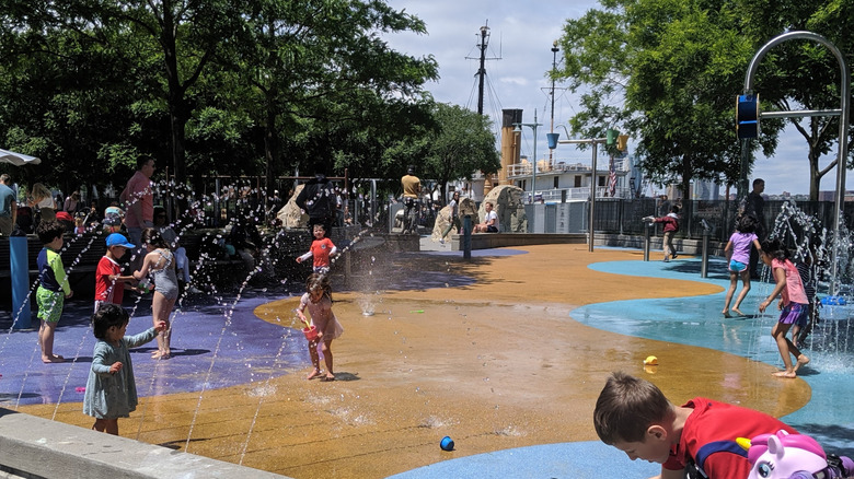 Kids playing on the splash pad at Pier 25 in Manhattan