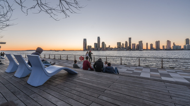 End of Pier 25 in Lower Manhattan with a sunset view across the Hudson River