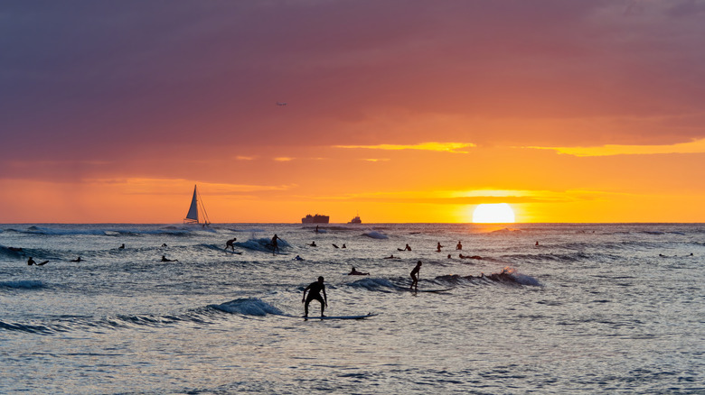 Surfing at Waikīkī Beach, O'ahu.