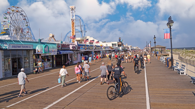 Beachgoers wander boardwalk in Ocean City, New Jersey