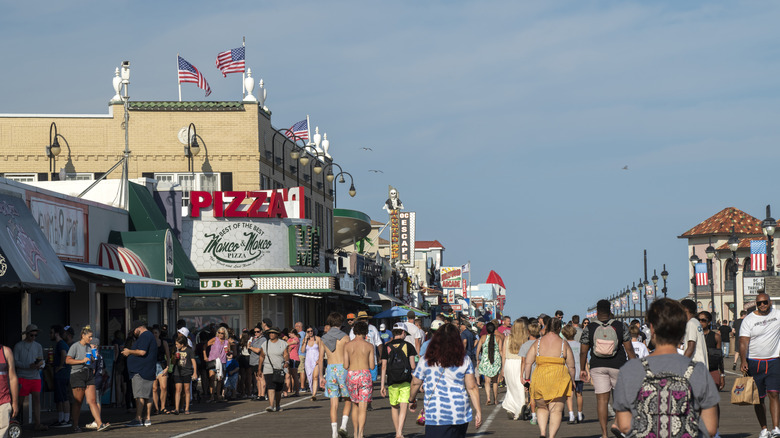 Crowds stroll past restaurants and businesses on Ocean City Boardwalk