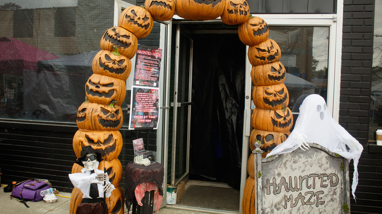 An archway of jack-o-lanterns covers a storefront door at the 2025 Odon Harvest Festival