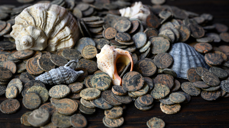 Bronze Roman coins with seashells