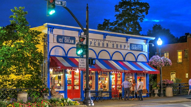 The Chagrin Falls Popcorn Shop at night with people out front