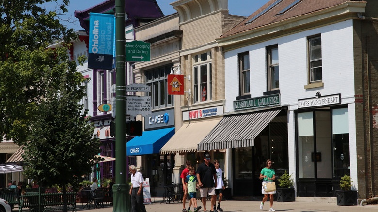 People walking along store fronts in downtown Granville, Ohio