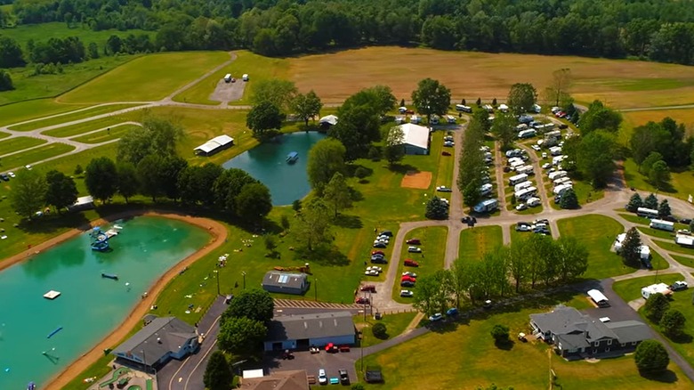 An overview of Baylor Beach Park with the beach, campers, and greenery in the frame.