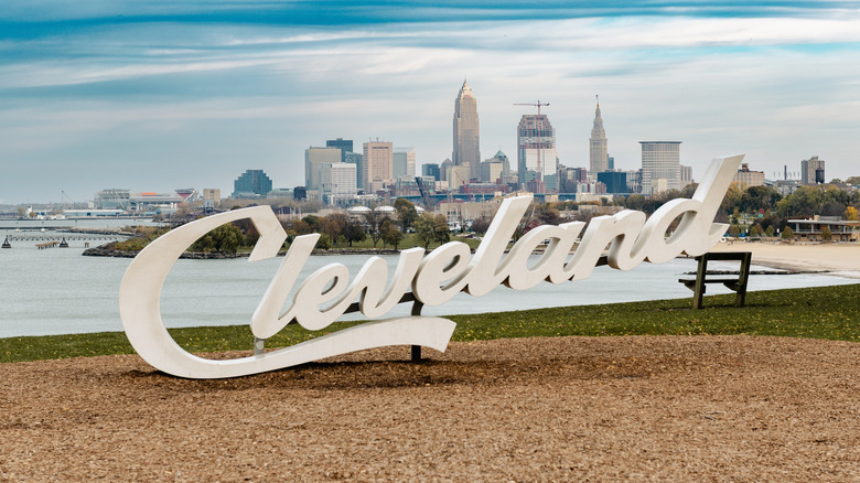 Cleveland Script sign at Edgewater park with city skyline in the background