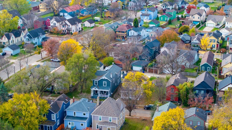 Neighborhood near Dayton, Ohio with colorful homes and autumn trees.