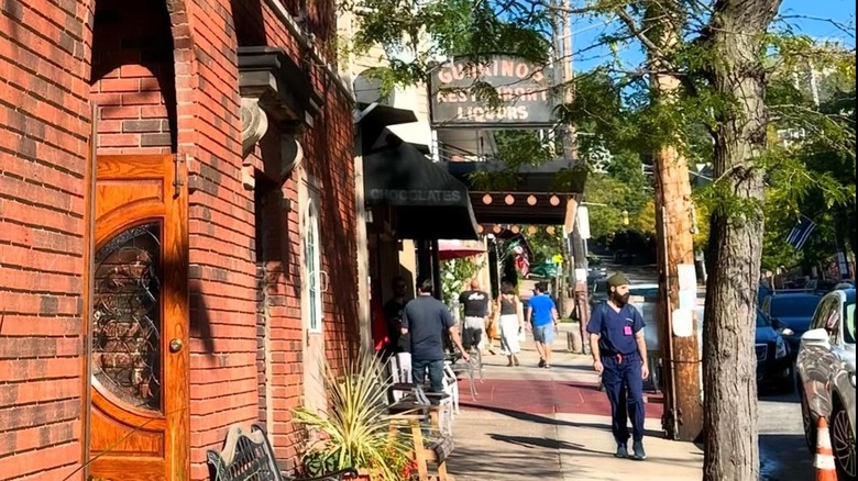 People walking down the street in Cleveland's Little Italy neighborhood