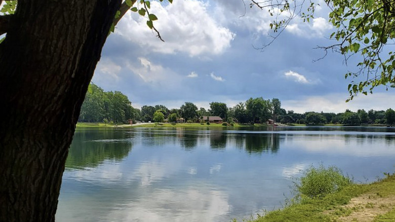 A look at the lake surrounded by trees on a cloudy day in Olander Park in Sylvania, Ohio