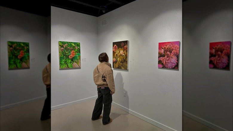 Woman observing art exhibits at the Massillon Museum, Ohio