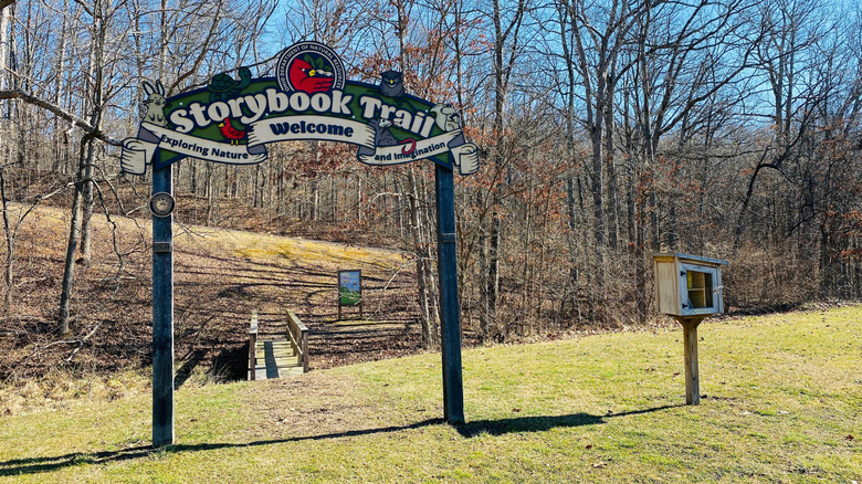 Entrance to a Storybook Trail with the small free library beside it