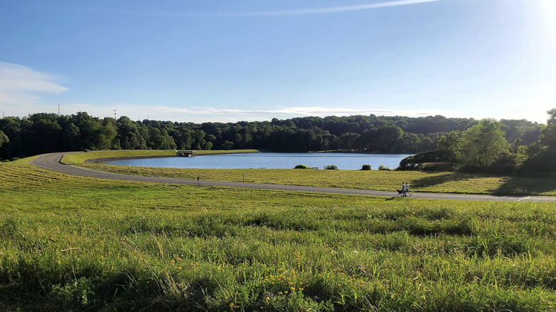 A view of Silver Creek Lake and the Miner's Trail at Silver Creek Metro Park on a sunny day
