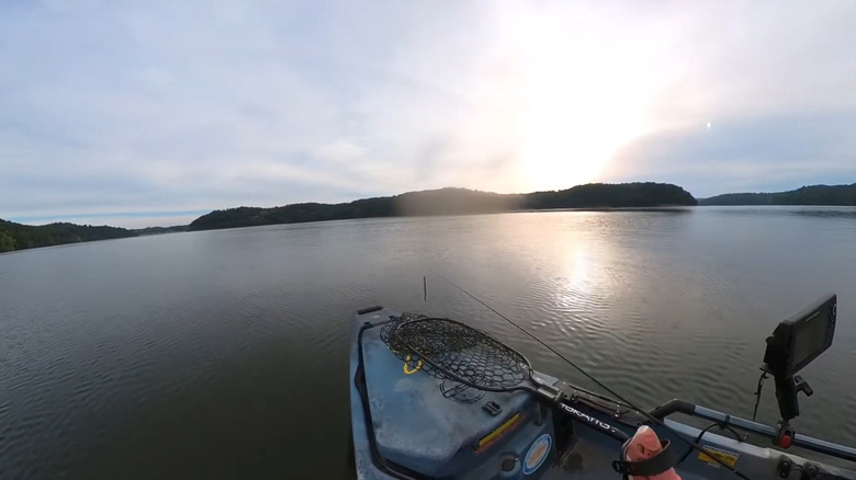 A boat riding through Piedmont Lake.
