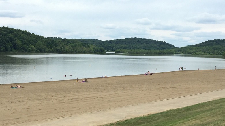A sandy beach in Dillon State Park on a partly cloudy day