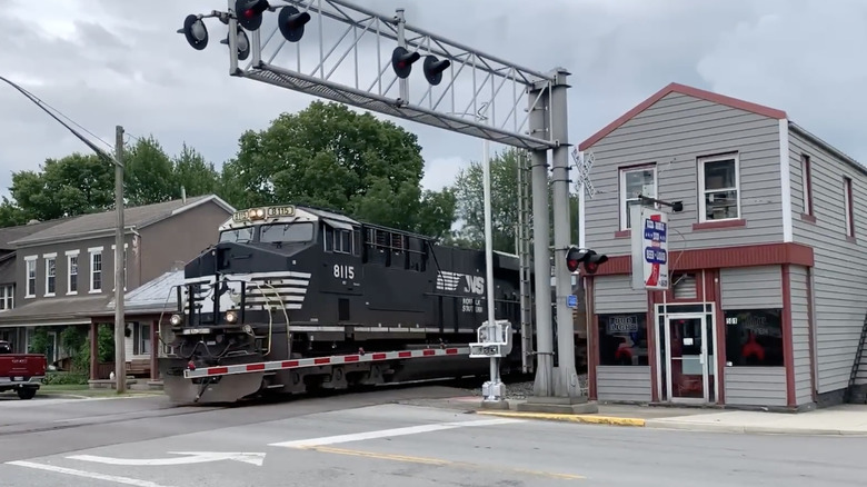 Train passing through downtown cloudy day