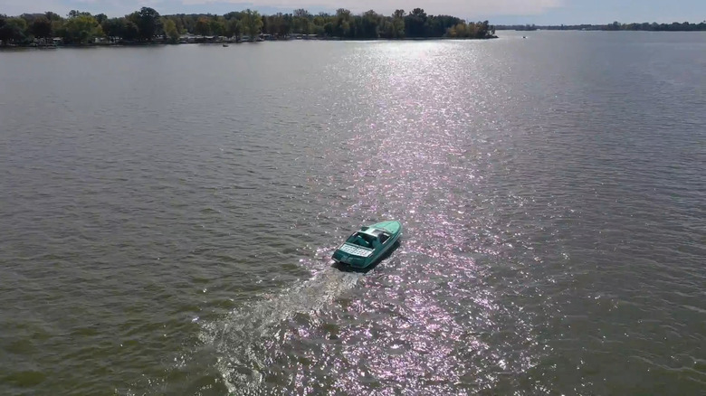 A boat cruising along Indian Lake at Russells Point