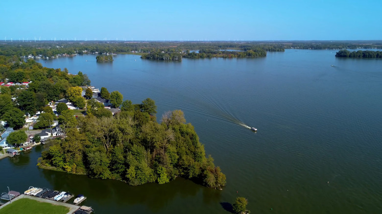 A picturesque day on Indian Lake Reservoir with a boat cruising though it
