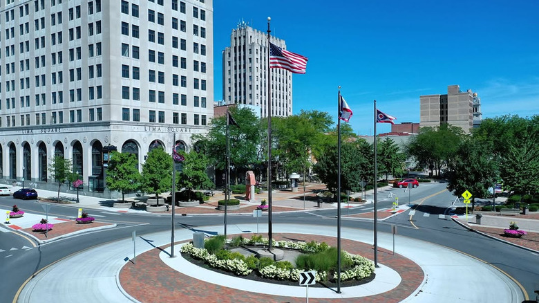 Circular street in Downtown Lima, Ohio with flags in the foreground