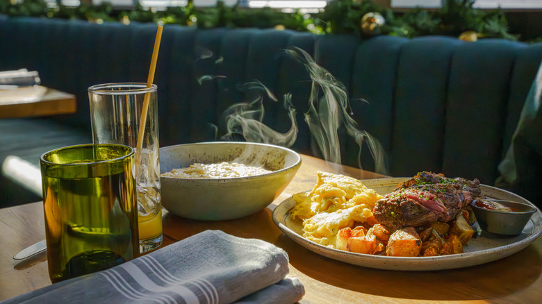 Steak and eggs served on a plate