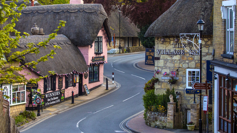 The curving street in the Old Village of Shanklin with thatched-roof stone buildings