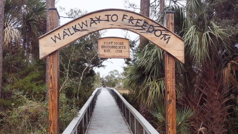 Arch that says Walkway to Freedom with a walkway under it