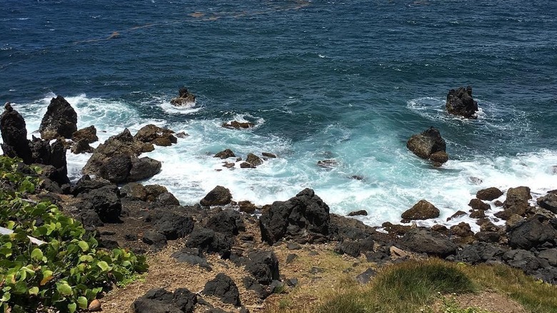 Rocky black sand shore of Dieppe Bay Beach in St Kitts