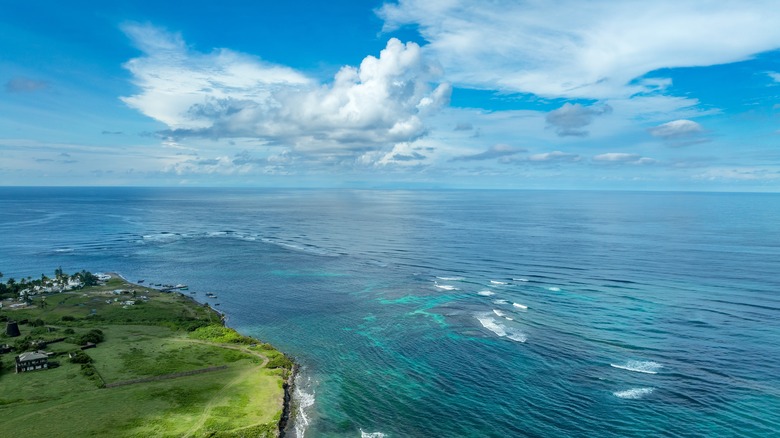 Green land and blue waters surrounding Dieppe Bay Beach