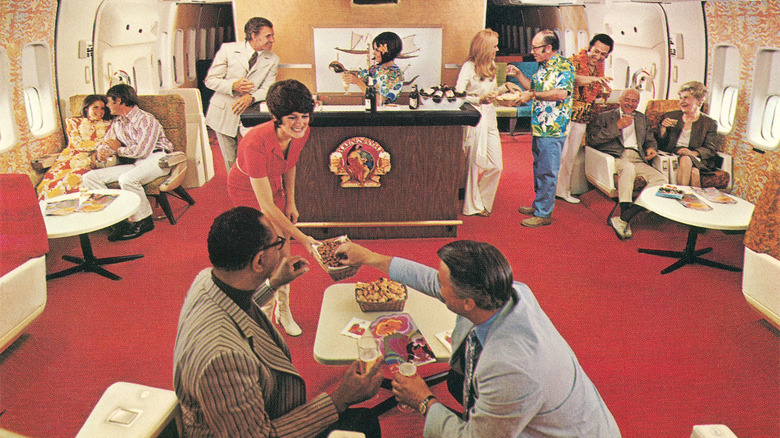 An airline lounge from the 1970s with a central bar and passengers being served drinks and food