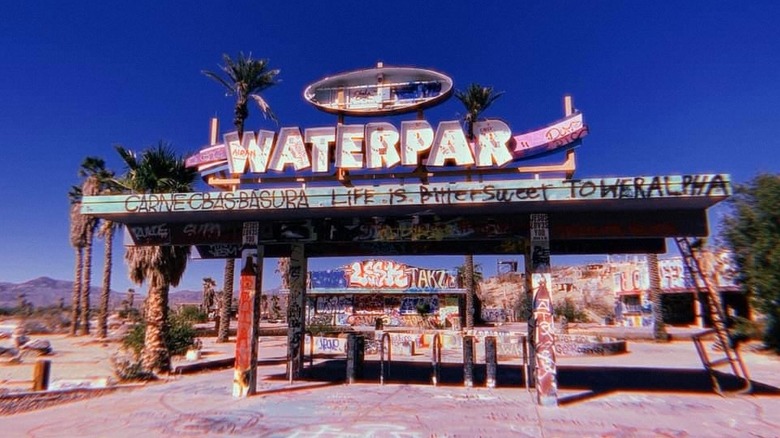 Entrance sign in ruins at former California water park