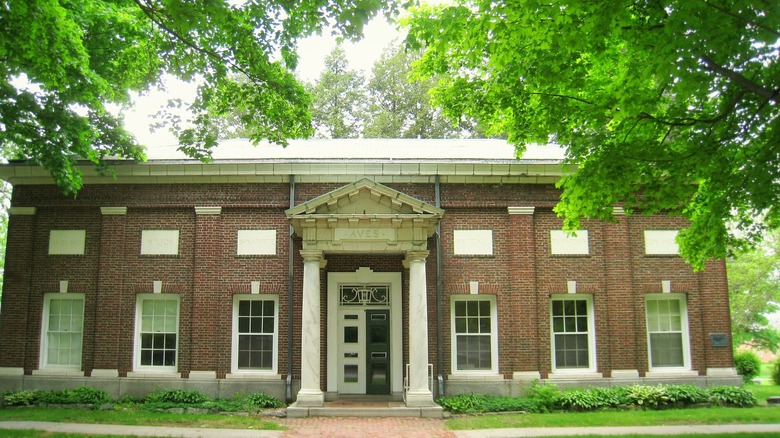 Brick Aves building with white trim and trees at Atlantic Union College