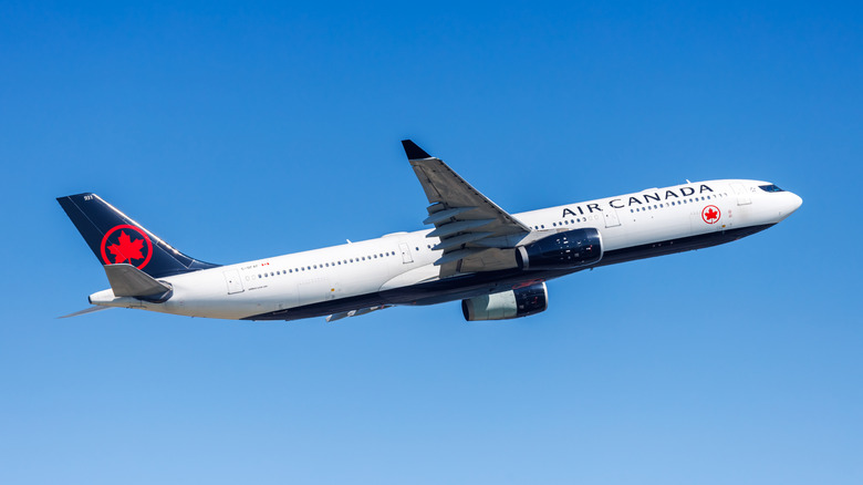 Air Canada Airbus A330-300 airplane flying through the sky