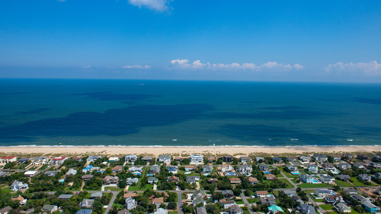view of sandbridge beach houses and shore