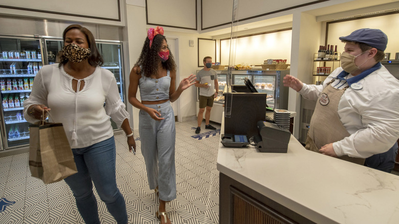 Two women buying groceries at Disney World