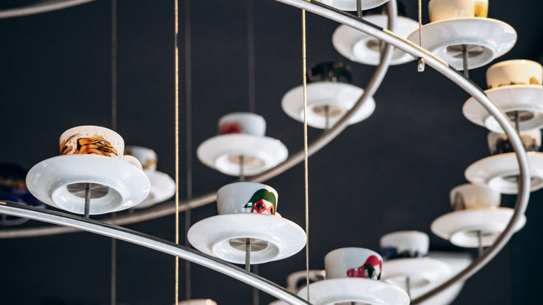A unique chandelier made of coffee cups hanging in the Illy Caffè in Trieste