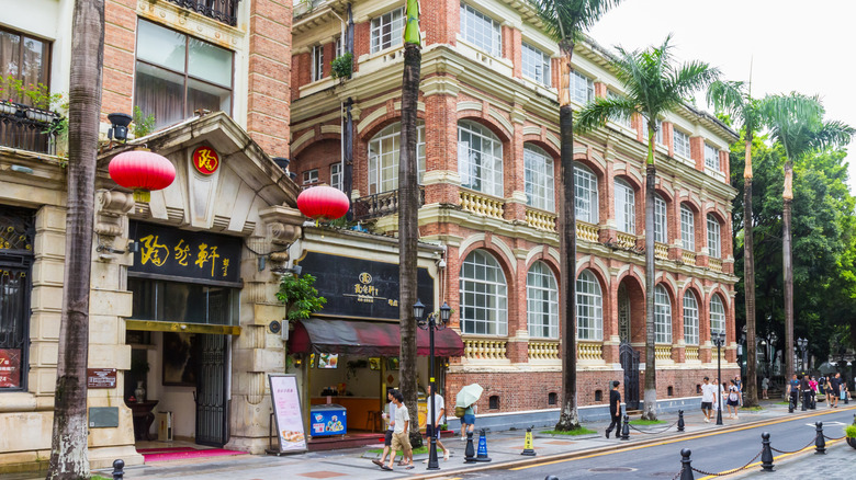 European-style building facades next to a building decorated with red lanterns