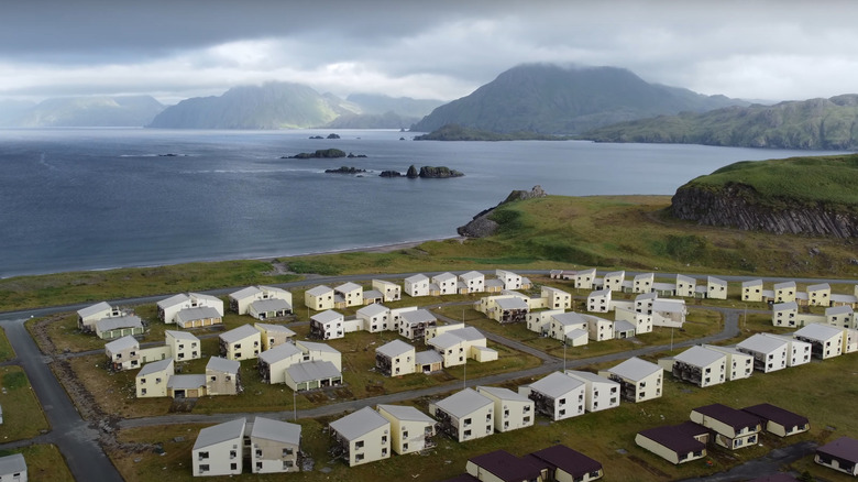 Aerial view over deserted military base buildings
