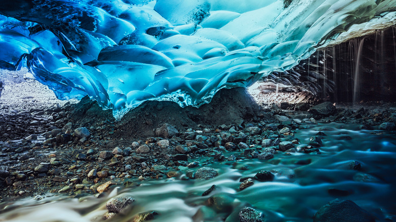 Blue ice dripping with water in the Mendenhall Ice Caves