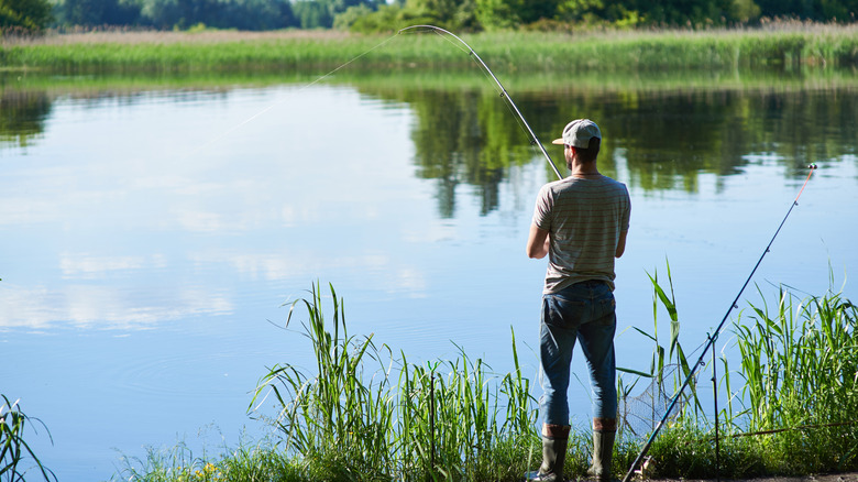 A man fishing on a lake