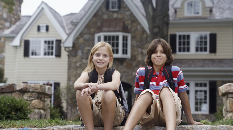 Sister and brother with school bags in Chatham, New Jersey